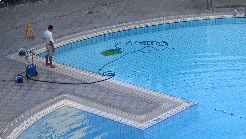 Watching the robot clean the pool