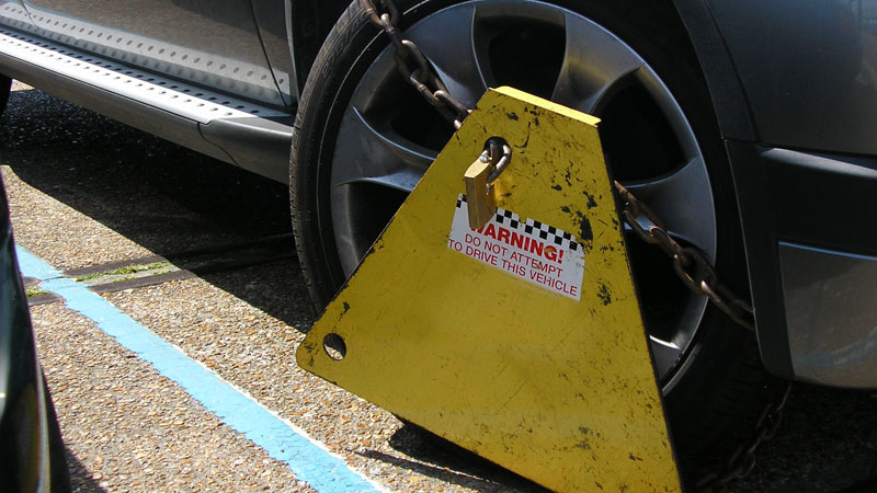 Need to report an untaxed vehicle? Here's how to call the clampers
